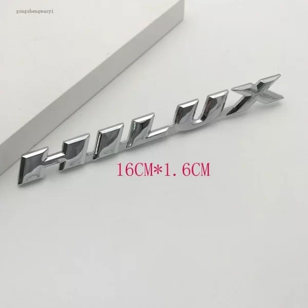 EMBLEMA HILUX PLASTICO
